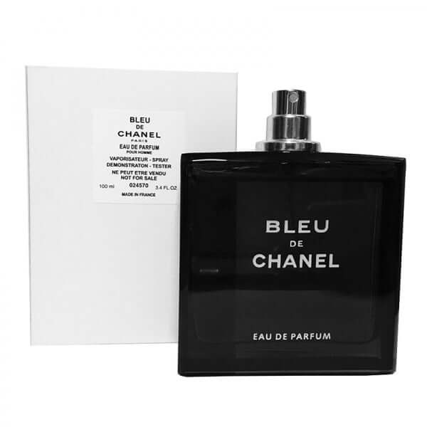 Uncapped Bleu de Chanel Men bottle revealing spray nozzle, shown beside tester packaging