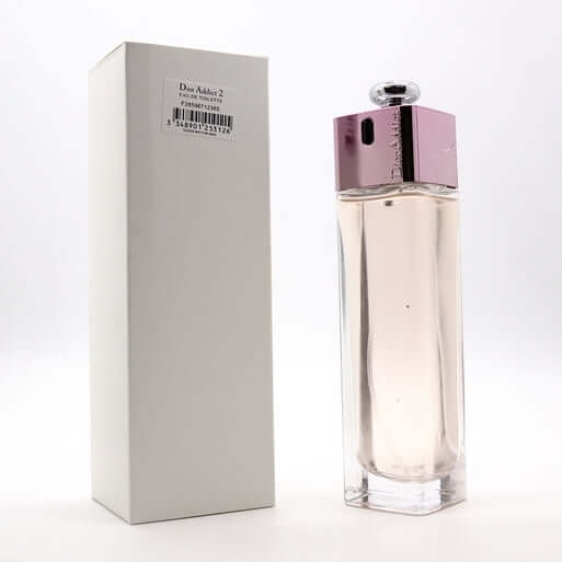 Dior Addict 2 Women fragrance bottle displayed beside plain white box, minimalist vertical setup