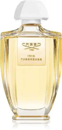 Iris Tubereuse by Creed in tall clear glass flacon with gold front plate and floral composition