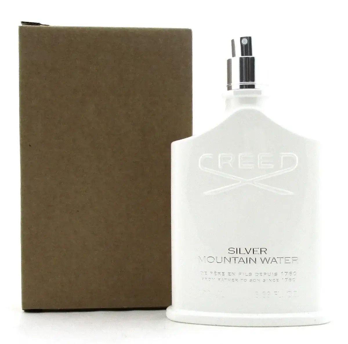 Creed Silver Mountain Water bottle without cap placed beside plain brown tester box