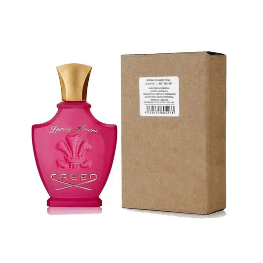 Creed Spring Flower tester bottle with brown box, metallic gold cap, and signature pink glass