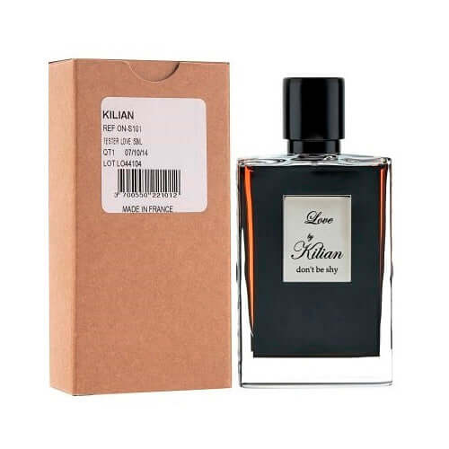 Capped Kilian Love Don't Be Shy fragrance placed next to plain tester box on neutral background