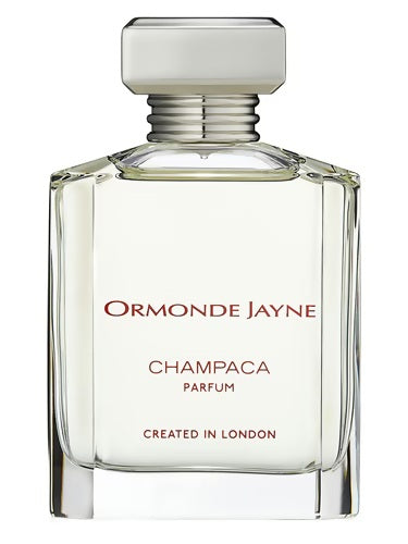 Ormonde Jayne Champaca Parfum bottle with clear glass, silver cap, and minimalist label reading "Created in London", showcasing the elegant floral fragrance.
