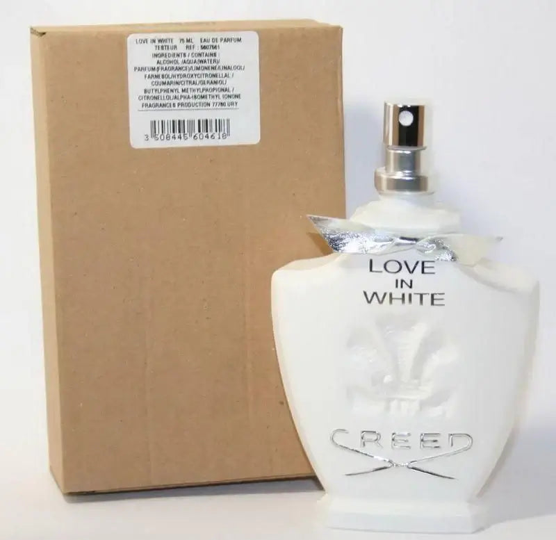 Creed Love In White bottle with tester label next to plain brown box, cap removed