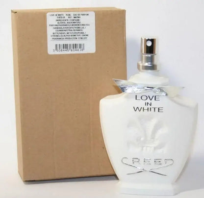 Creed Love In White bottle with tester label next to plain brown box, cap removed