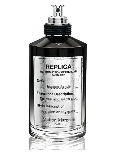 Maison Margiela Replica Across Sands EDP 100ml bottle with exposed atomizer and reflective label displaying fragrance notes