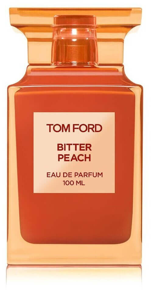 Tom Ford Bitter Peach tester bottle with transparent peach-toned cap and bold orange flacon design
