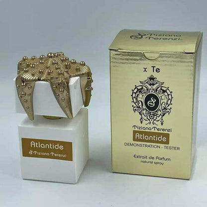 Luxurious Tiziana Terenzi Atlantide tester with ornate crown cap and reflective golden packaging