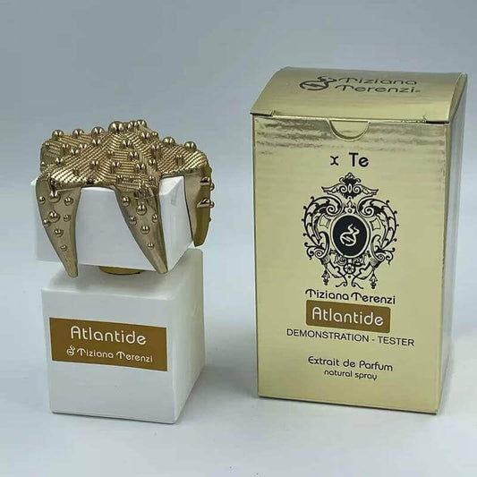 Luxurious Tiziana Terenzi Atlantide tester with ornate crown cap and reflective golden packaging