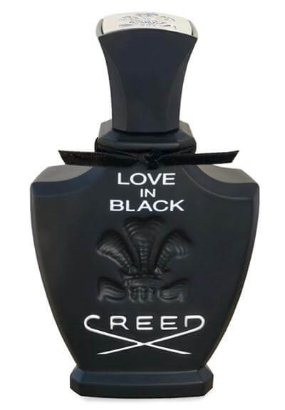 Matte black Creed Love In Black bottle with embossed crest and silver collar, no box visible