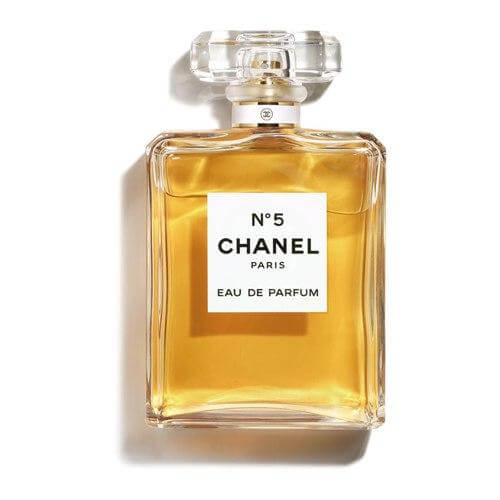 Chanel No 5 Eau de Parfum bottle with iconic rectangular cap and golden liquid on white background