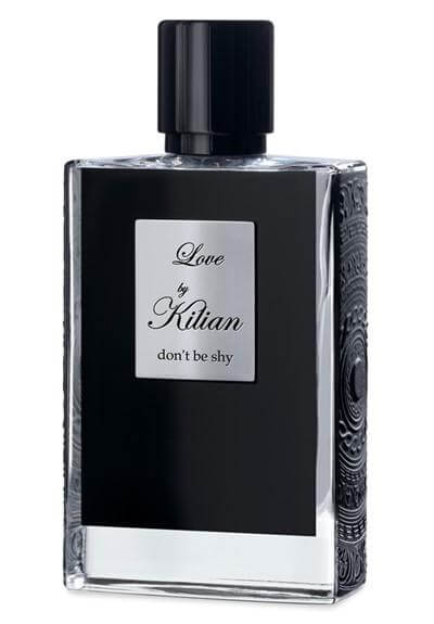 Sleek Kilian Love Don't Be Shy bottle with glossy black cap and silver label standing on white surface